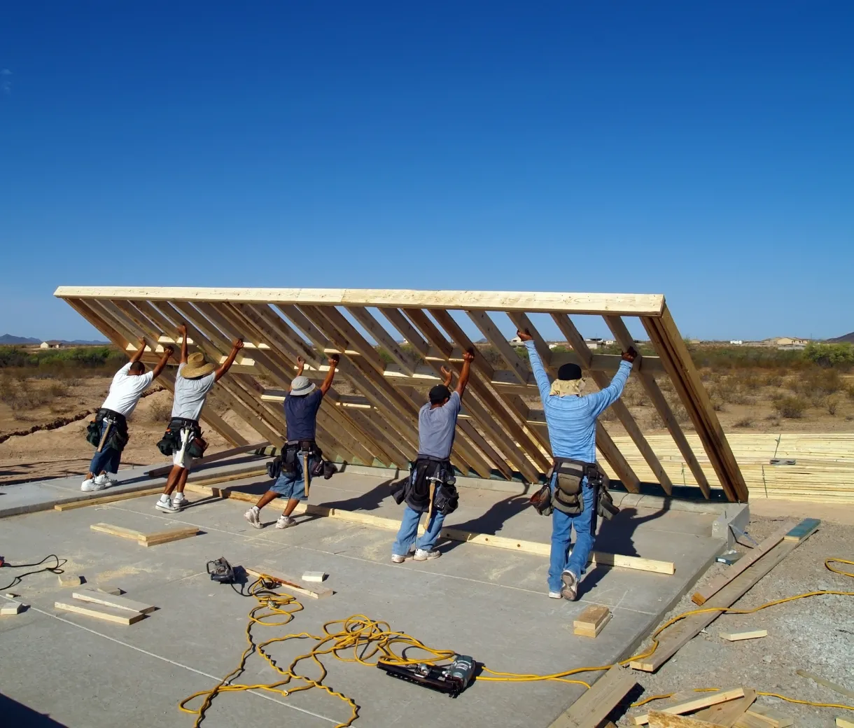 Professional framing crew installing structural wood framing for residential and commercial construction projects in Dallas TX