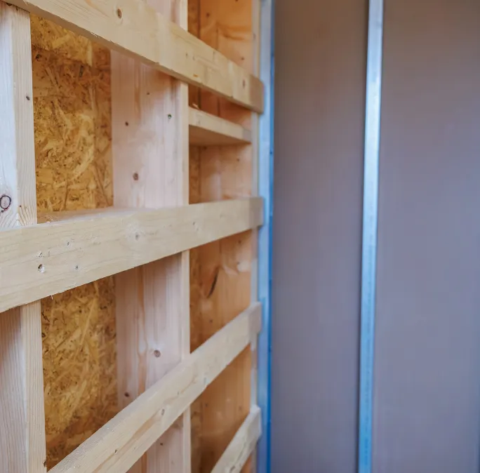 Wood and metal stud framing installation detail by Framing Pro Dallas showing structural framing components, precision stud alignment, and professional framing craftsmanship for residential and commercial builds.