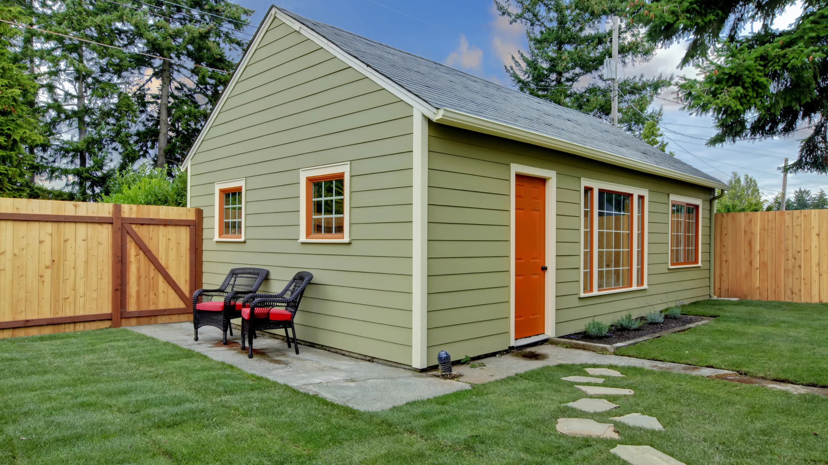 Completed ADU backyard guest house in Dallas with siding, windows, roofing, and exterior finishes complete.