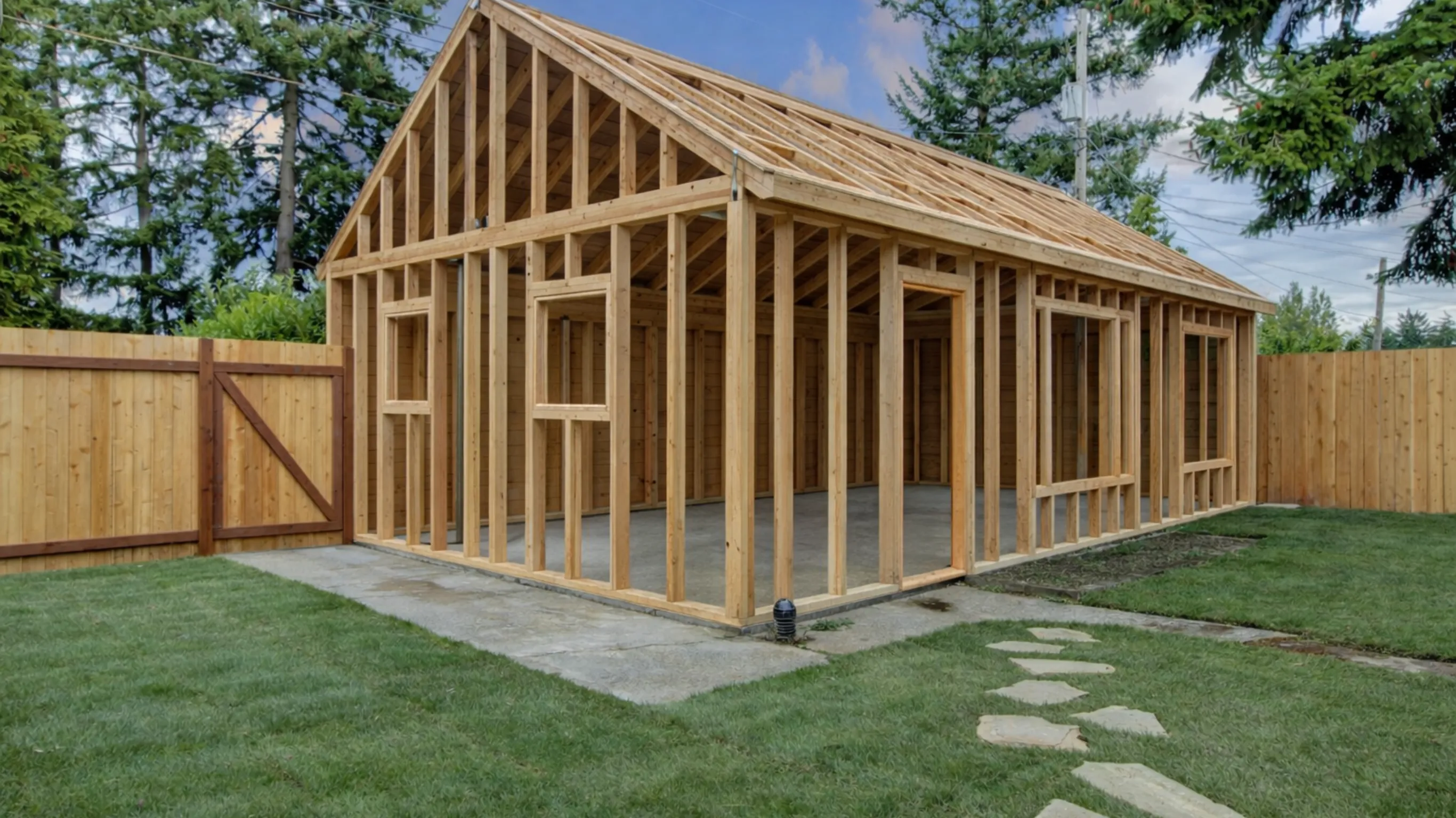 ADU backyard framing project in Dallas showing exposed wood framing before exterior finishes.