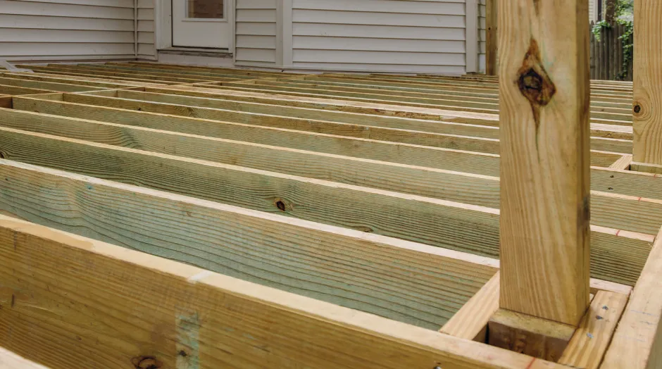 Backyard deck framing in Dallas with pressure-treated joists and structural beam layout